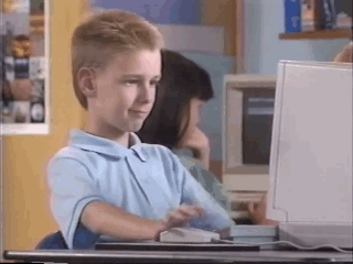 An awesome 90 kid giving the thumbs up on a desktop PC